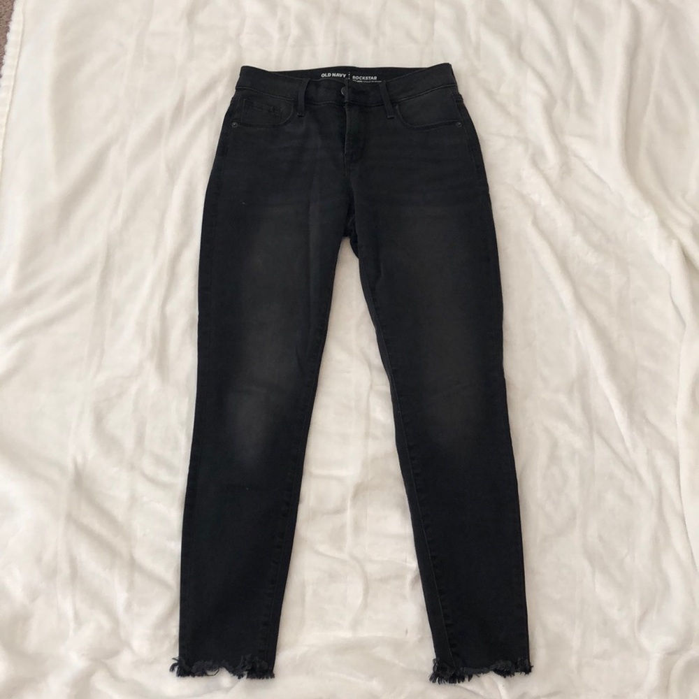 Black jeans with frayed ends